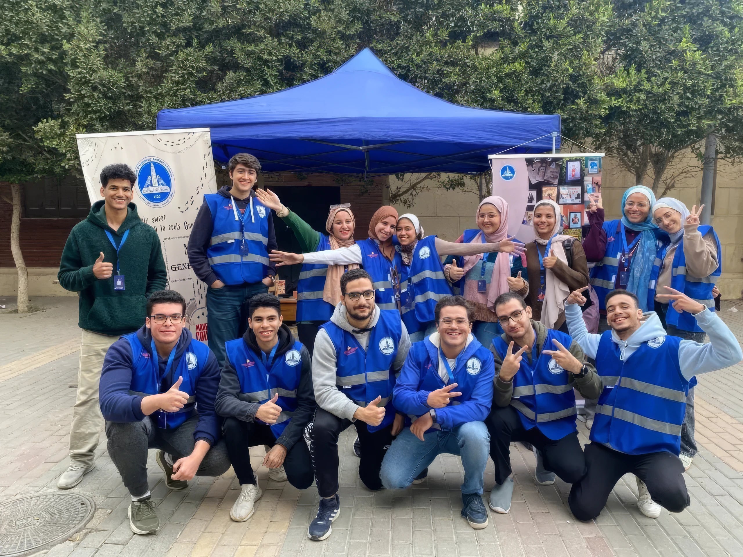 Aviation Club website: Club members in blue event vests in front of the Aviation Club tent