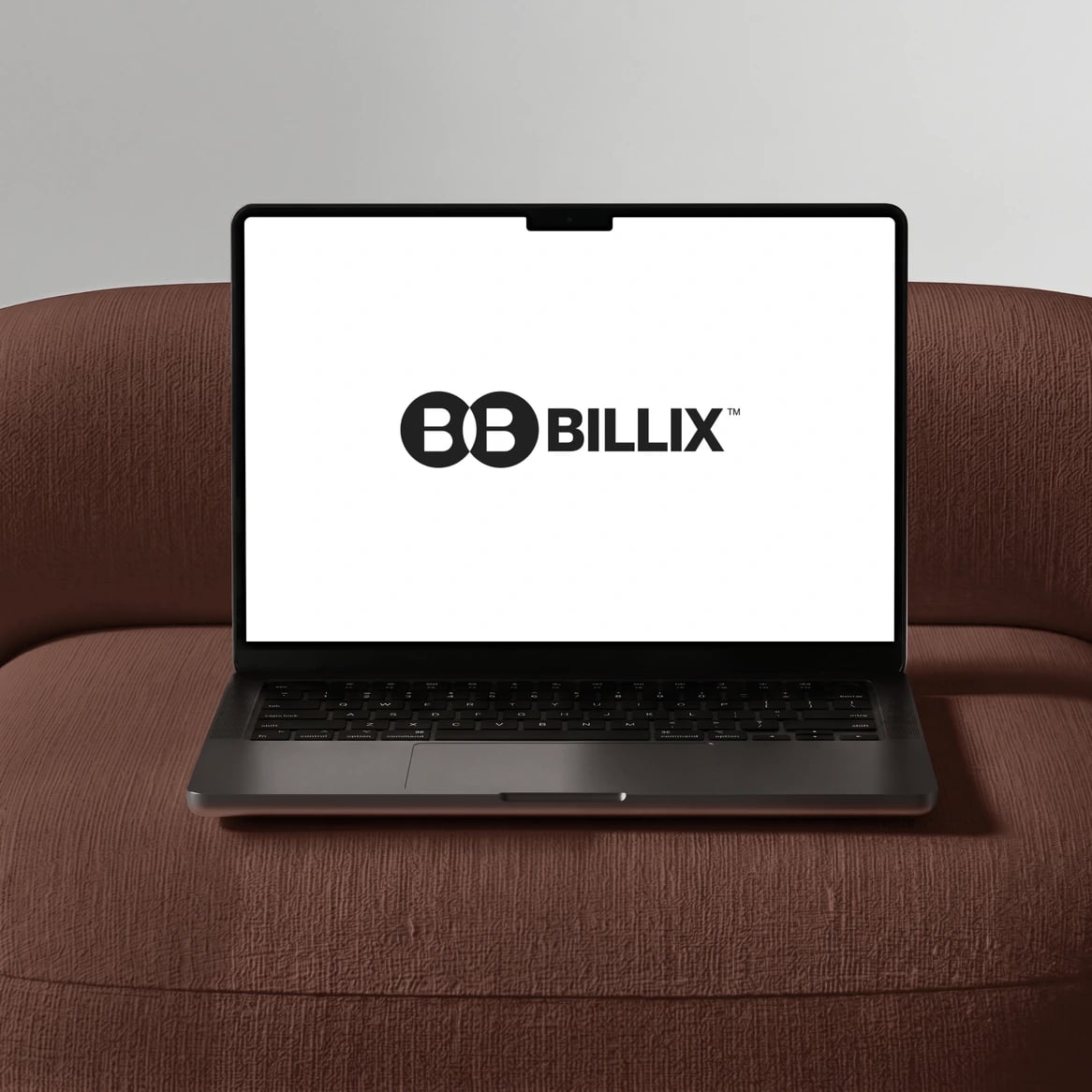 Billix website: Billix cover: a laptop showing the Billix logo on a terracotta sofa
