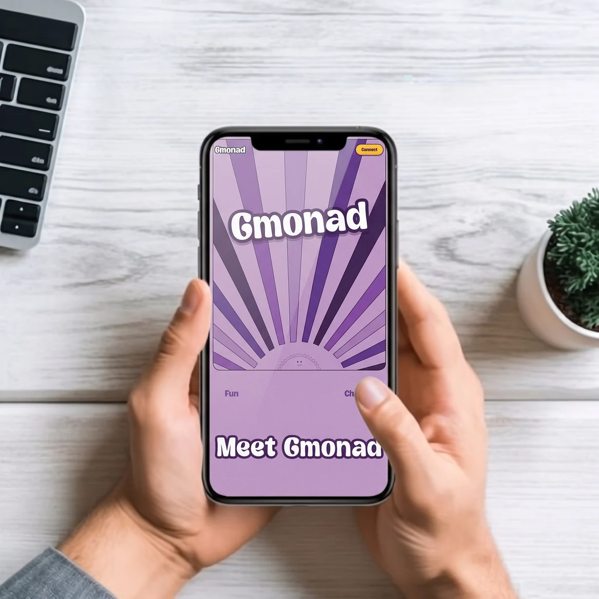 GMONAD website: Hands holding a phone showing the Gmonad mobile homepage hero